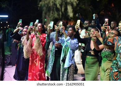 Dakar, Senegal, Africa, May 26 2022, Young Fans Of A Music Group All Take A Photo Of Their Star