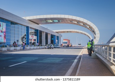 DAKAR, SENEGAL, FEBRUARY 22 2018: Departure Platform On The New Blaise Diagne Airport In Dakar, Senegal On A Sunny Day. Some People, Security Guards And Cars Are Seen Parked.