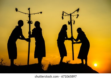 Daklak, Vietnam - Mar 9, 2017: Ede Ethnic Minority People Perform Traditional Dance In Their Festival In Sunset Period. Silhouette.