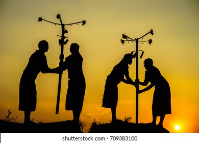 Daklak, Vietnam - Mar 9, 2017: Ede Ethnic Minority People Perform Traditional Dance In Their Festival In Sunset Period. Silhouette.