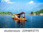 Dal Lake and the beautiful mountain range in the background in the city of Srinagar Kashmir, India.	
