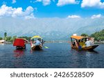 Dal Lake and the beautiful mountain range in the background in the summer Boat Trip of city Srinagar Kashmir India.	