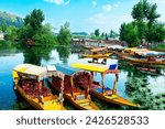 Dal Lake and the beautiful mountain range in the background in the summer Boat Trip of city Srinagar Kashmir India.	