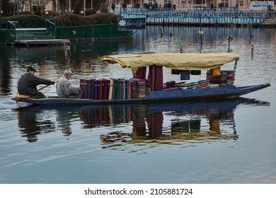 Dal Lake, Srinagar, Kashmir, India - February 18 2012 : Traditional Kashmiri Blue Boat with Traditional Kashmiri pashmina cloth shop. 