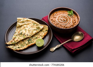 Dal makhani or daal makhni is a popular food from Punjab / India made using  whole black lentil, red kidney beans, butter and cream and served with garlic naan or Indian bread or roti