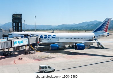 DALAMAN - JUNE 04, 2014: Loading Operations In Airport Dalaman Turkey,Transaero Tours CENTER - One Of The Leading Company In Air Cargo In Russia. 