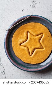 Dalgona Candy -  Treat. Round Sugar Cookie With A Star Inside, Top View.