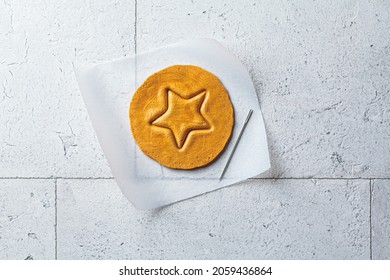 Dalgona Candy - Treat. Round Sugar Cookie With A Star Inside, Top View.