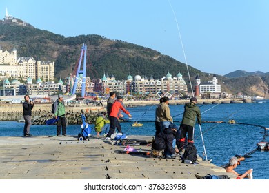 Dalian, China - October 27, 2015 : People Enjoy Fishing At Xinghai Bay. Chinese Leisure Activity In Dalian, China