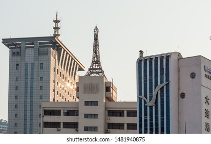 Dalian, Liaoning, China - 21 May 2009: Replica of the Eiffel Tower on the roof of Port of Dalian Authority Building
