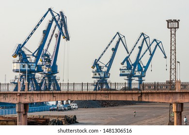 Dalian, Liaoning, China - May 21 2009: Crane booms in Dalian Harbour