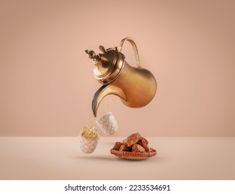 dallah is a metal pot with a long spout designed specifically for making Arabic coffee, Saudi coffee wood background, arabic coffee and dates. - Shutterstock ID 2233534691
