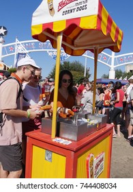 DALLAS, TEXAS—OCTOBER 2017:  The Famous Corn Dog Is The Word Of The Day And A Must-eat Item At The State Fair Of Texas Carnival Grounds In Dallas.