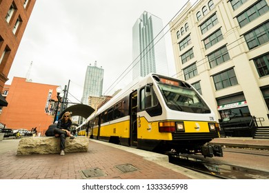 DALLAS - CIRCA MARCH 2018: The Dallas DART Light Rail Train Drives Through Downtown Near Deep Ellum In Dallas, Texas.