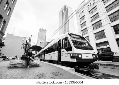 DALLAS - CIRCA MARCH 2018: The Dallas DART Light Rail Train Drives Through Downtown Near Deep Ellum In Dallas, Texas.