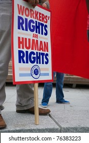 DALLAS - MAY 1, 2011: An unidentified demonstrator holds a pro-workers' rights sign from the AFL-CIO during a May Day protest on May 1, 2011 in Dallas, Texas.