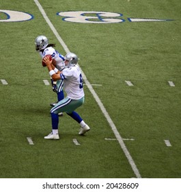 DALLAS - OCT 5: Quarterback Tony Romo Receives Snap From Center As Marion Barber Stands By In Texas Stadium In Irving, TX On Sunday, October 5, 2008.