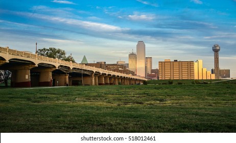 Dallas Skyline With The Bridge And Green Grass And Blue Sky