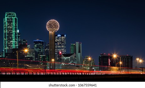 Dallas Skyline By Night With Traffic Trails On Tom Landry Freeway