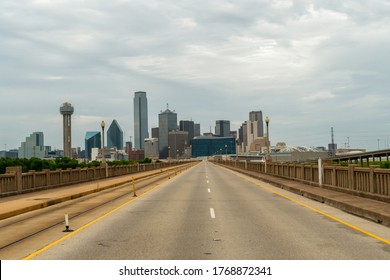 Dallas Skyline From Empty Highway With Dense Clouds On The Sky