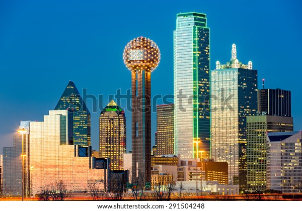 Dallas skyline at\
sunset