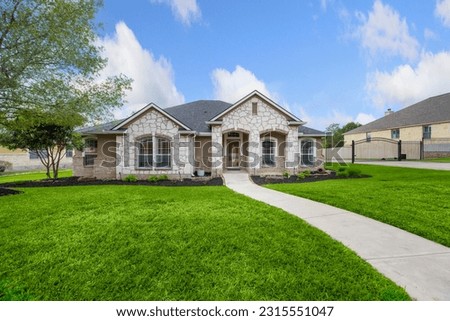 Dallas, texas - april 2023: a home with a lawn 