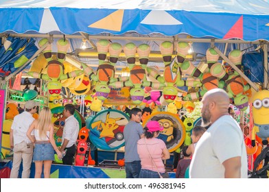 DALLAS, TEXAS - OCTOBER 07: People Playing Games At A Booth Game At The State Fair Of Texas On October 07, 2016 In Dallas, Texas.