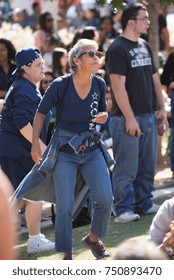 Dallas, Texas, October 18, 2015: Older Woman Dancing At The Carnival’s Ultimate Cowboys Fan Fest At Klyde Warren Park