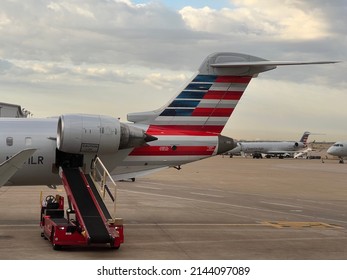 DALLAS, TEXAS, USA – MAR 31, 2021: American Airlines Airbus A320 airplanes at DFW Airport runway. Airbus is a European aircraft manufacturer based in Toulouse, France.
