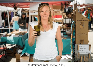 Dallas, Texas / USA - May 17, 2014: Woman Holding A Glass At An Outdoor Market In Dallas, TX