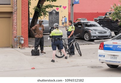 Dallas, Texas / USA - May 28, 2016: Two Dallas Police Officers Talking To A Man On The Street