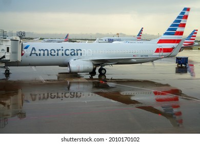 DALLAS, TX -18 MAY 2021- View of the reflection of the plane logo from American Airlines (AA) after the rain at the Dallas Fort Worth International Airport (DFW), the largest hub for American.