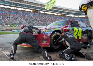 DALLAS, TX - NOVEMBER 04: Jeff Gordon Tire Change During At Pit Stop At The Nascar Sprint Cup AAA Texas 500 At Texas Motorspeedway In Dallas, TX On November 04, 2012