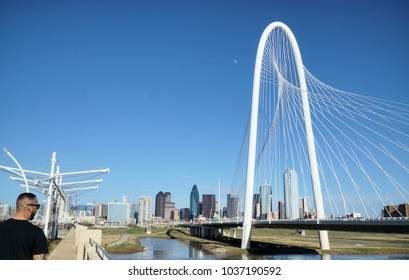 Dallas, TX / USA / 2/25/2018 - A Man Standing On The Ronald Kirk Pedestrian Bridge Looks Out At The Margaret Hunt Hill Bridge. The Bridges Connect The Trinity Grove Area To Downtown Dallas.