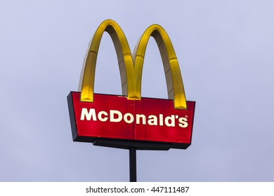DALLAS, Tx, USA - APR 17, 2016: McDonald's restaurant sign and logo illuminated at dusk. McDonald's is the world's largest chain of fast food restaurants