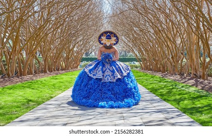 DALLAS, UNITED STATES - Apr 30, 2022: A Back View Of A Girl In A Blue Quinceanera Dress In Dallas, Texas, USA