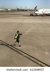 DALLAS, USA - MAR 30, 2017: DFW International Airport With American Airlines Aircraft Carrier Signal Man