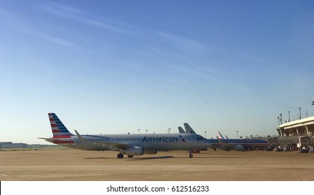  DALLAS, USA - MAR 30, 2017: DFW International Airport Runway With American Airlines  Aircrafts Getting Ready For Take Off. 