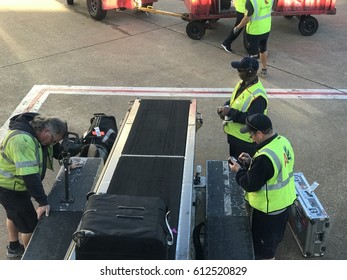 DALLAS, USA - MAR 30, 2017: DFW International Airport Loading Zone Of American Airlines Employees Landing Bags Into Aircrafts 