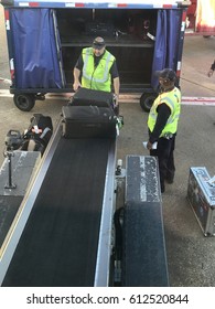 DALLAS, USA - MAR 30, 2017: DFW International Airport Loading Zone Of American Airlines Employees Landing Bags Into Aircrafts 