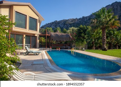 Dalyan, Turkey - June 9 2018: Panoramic View Of Luxury Villa With Swimming Pool And Tropical Garden. 