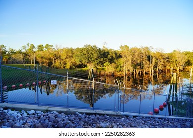 A dam on Hillsborough river at Tampa, Florida at sun set	 - Shutterstock ID 2250282363