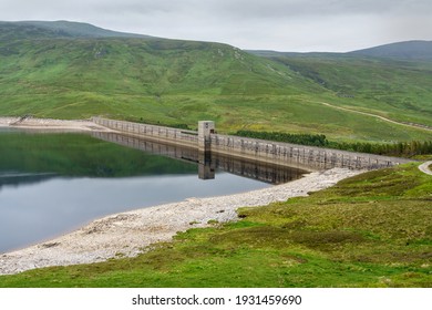 The Dam Wall Of Loch Daimh Reservoir Water Supply In The Scottish Highlands, UK Landscapes.