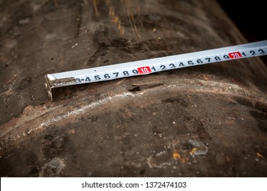 Damage measurement. Fuel line. Defect - a crack in the pipeline pipe. Photographed in Ukraine. Kiev region. Horizontal frame. Color image
