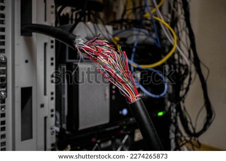 Damage to a multi-core telecommunication cable is a close-up. An accident on the Internet network, a wire break.