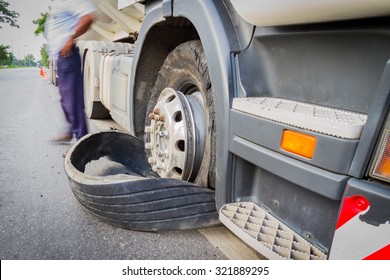 Damaged 18 Wheeler Semi Truck Burst Tires By Highway Street, With Blurred Driver.