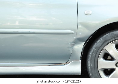 Damaged Car With A Dent Near The Wheel - Can Be Considered As A Fender Bender