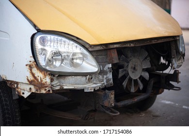 Damaged Car. Dents On The Machine Body. Rust And Scratches. A Deflated Wheel And Other Parts Requiring Repair By A Vehicle.