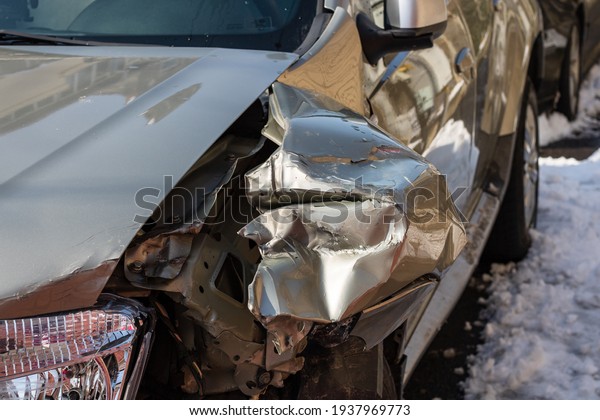Damaged car detail on crushed car, wrecked vehicle.\
Crushed metal and plastic after a traffic accident in Bucharest,\
Romania, 2021