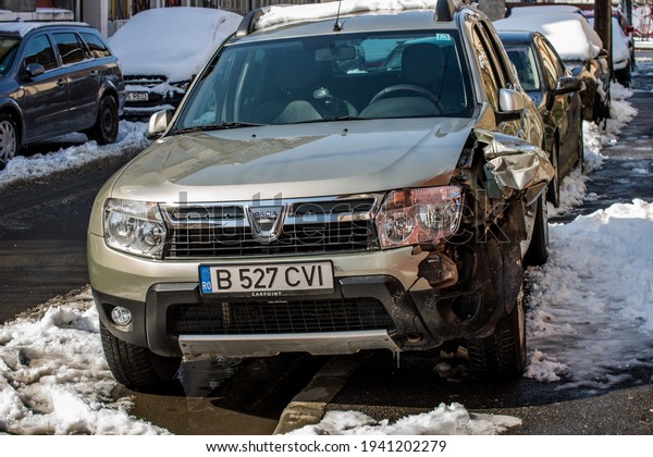 Damaged car detail on crushed car, wrecked vehicle.\
Crushed metal and plastic after a traffic accident in Bucharest,\
Romania, 2021